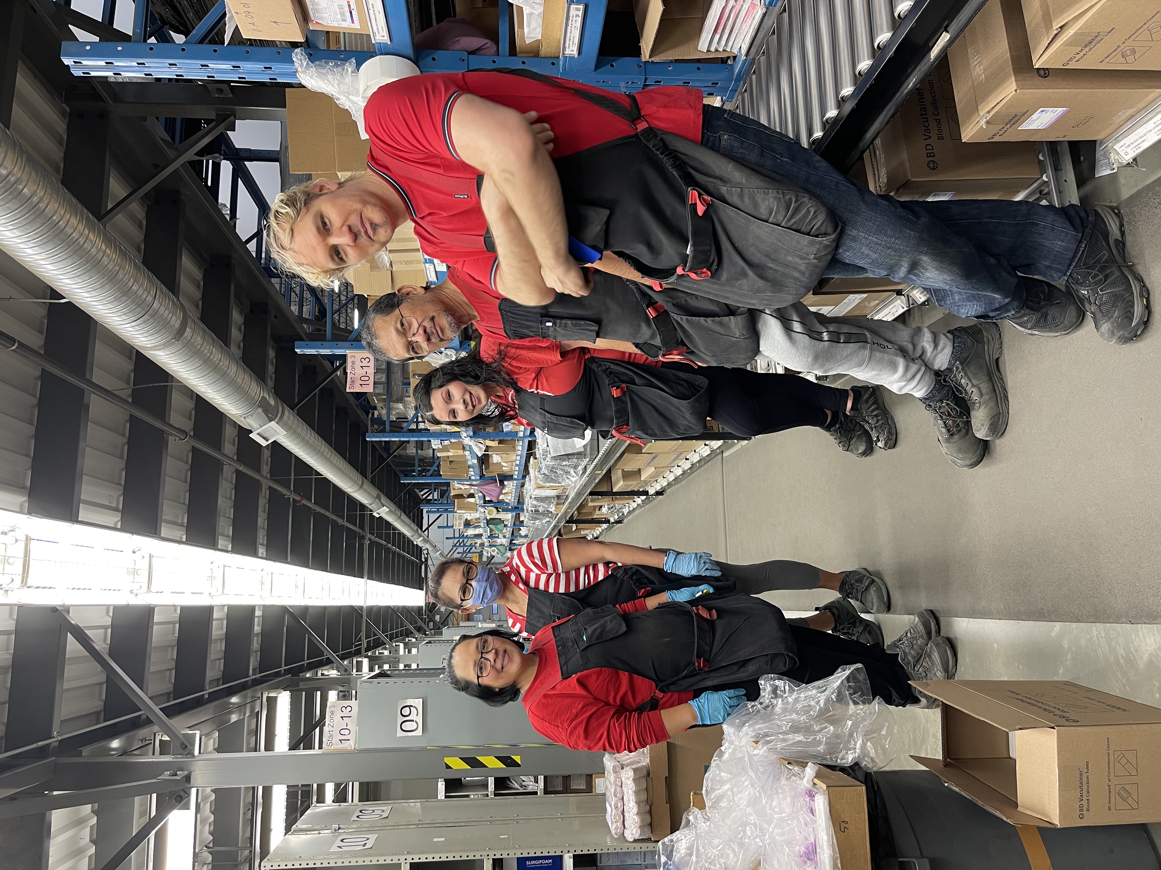 Tough-looking AUPE members in a warehouse pose in red.